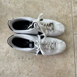 Black and white Nike Cortez sneakers
